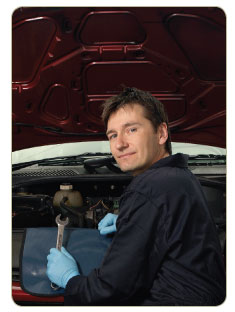 mechanic in front of engine